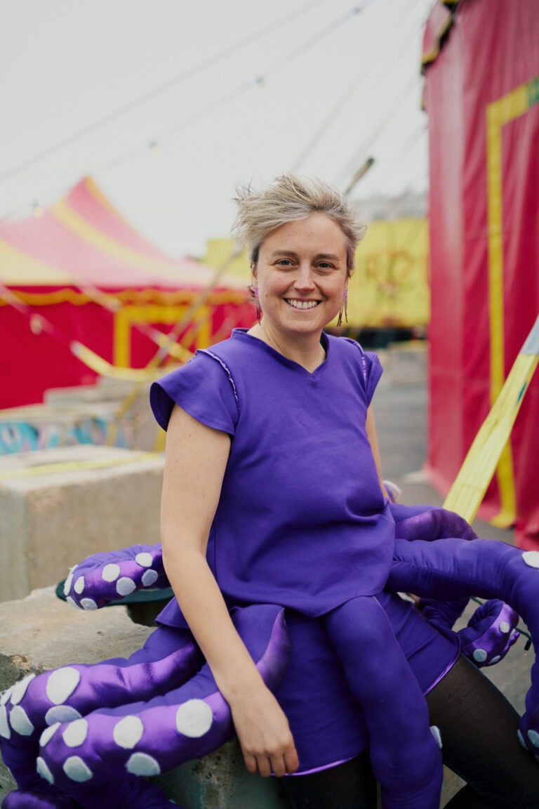 Julie Razet in her octopus costume in front of the circus